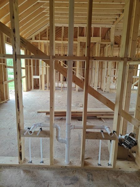 Drain, vent and supply rough-in in a new-construction framed wall