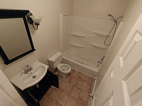 Bathroom before remodel, wide view