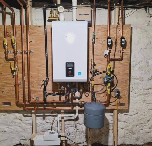 Wall-hung tankless combi boiler with copper piping and expansion tank
