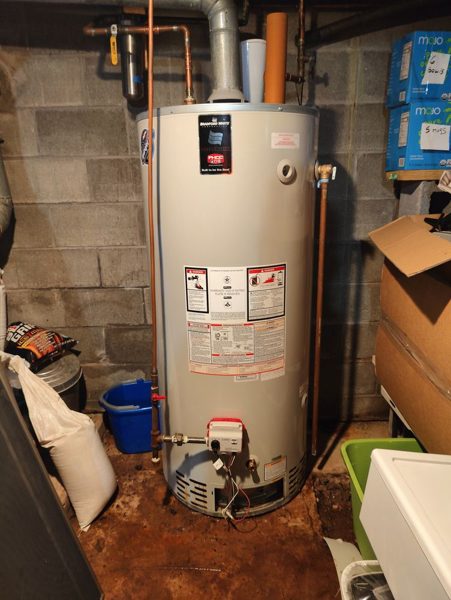 Replacement tank water heater in a basement